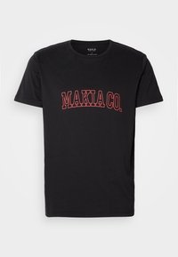 T-shirt noir à manches courtes avec col rond et texte « MAKIA CO. » en contours rouges centré sur le devant.