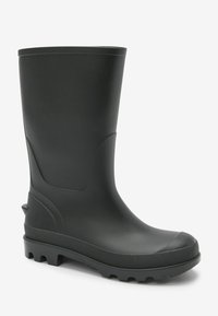 Stivale da pioggia in gomma nera con superficie liscia, punta arrotondata e suola texture. Presenta un tacco leggermente rialzato e sottili accenti laterali.