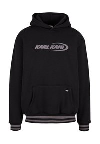 Černá mikina s kapucí vyrobená z bavlny, se velkým stříbrným logem "KARL KANI", klokanní kapsou a pruhovanými žebrovanými manžetami a spodním lemem.
