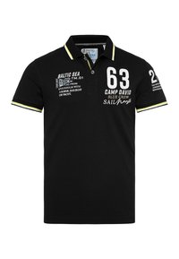 Black polo shirt made from cotton, featuring a collar, short sleeves, and contrasting yellow accents with printed text and numbers.