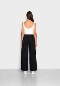 Weekday ONYX TROUSERS - Calças de ganga de perna direita - black
