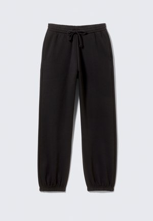 Black sweatpants made of soft fabric, featuring an elastic waist with a drawstring, side pockets, and elastic cuffs at the ankles.