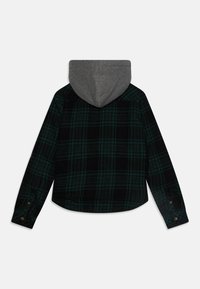 Plaid flannel shirt in black and green with a gray hood. Features long sleeves, button cuffs, and a rounded hem. Soft texture. Back view.