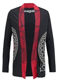 Cardigan noir à manches longues avec bordure fleurie rouge audacieuse et motifs, présentant des dessins géométriques blancs complexes sur les côtés et un détail signature.