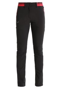 Pantalon noir à texture lisse, avec une ceinture rose à motif, deux poches avant et un logo sur la cuisse gauche.