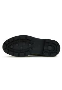 Sole in gomma nera con scanalature profonde, dotata di bottoni arrotondati e linee costolate per una migliore aderenza. Superficie liscia con una costruzione solida.