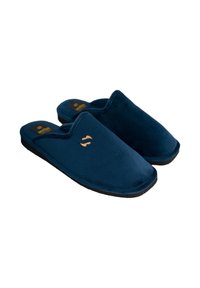 Zapatillas de color azul marino con una parte superior de tela suave, sin respaldo y una suela de goma negra. Presenta un pequeño logo naranja en el costado.