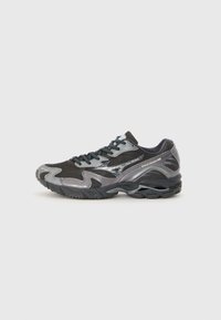 Gray running shoe with mesh upper, reflective accents, and textured rubber sole. Features tonal laces and streamlined design.