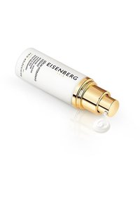 Weißer zylindrischer Hautpflegebehälter mit goldenen Akzenten, der eine Spirale aus Creme ausgibt. Aufdruck des Markennamens "Eisenberg" in schwarzem Text.