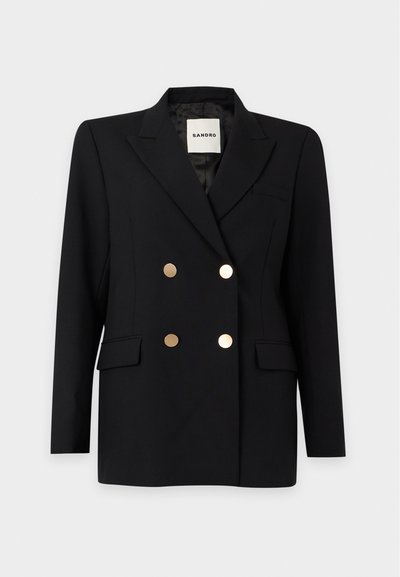 Blazer noir croisé avec boutons dorés, revers crantés, poches à rabat et une étiquette à l'intérieur indiquant "Sandro."
