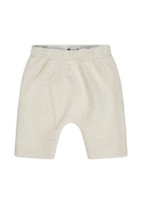 Cream-colored, plush shorts made of textured fabric with an elastic waistband and loose fit, featuring a rounded hem and casual design.