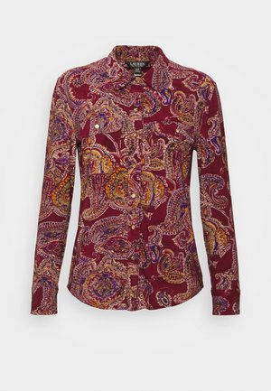 Langærmet skjorte med knapper og bordeaux paisley-mønster i lilla, gul og orange, med to brystlommer med klapper og knapper.