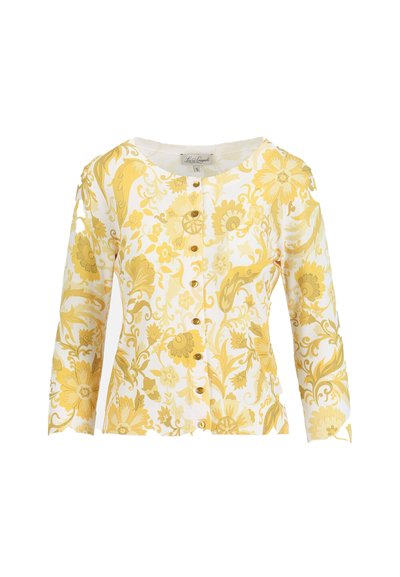 Cardigan blanc avec motif floral et feuilles jaunes, col rond, manches longues et rangée de petits boutons jaunes sur le devant.