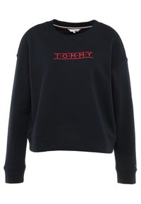 Sudadera azul marino hecha de algodón, con cuello redondo, mangas largas y logotipo bordado "T.O.M.M.Y." en rojo en el pecho.