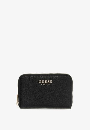 Portafoglio nero con cerniera a giro realizzato in pelle testurizzata, con logo in rilievo "GUESS EST 1981" in oro. Design compatto con chiusura a cerniera robusta.