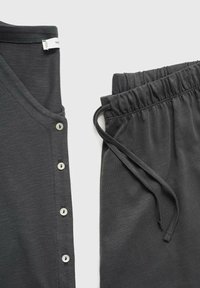 Dark gray top with a V-neck and five white buttons on the front, paired with matching elastic waistband pants featuring a drawstring.