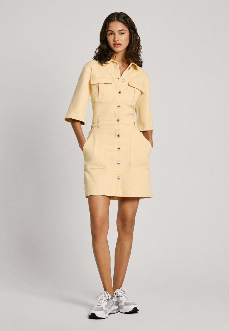 yellow denim dress Two-Piece Miss Minus Sized Functional chest pockets and a coordinating waist belt with silver hardware Denim + Yellow. - The