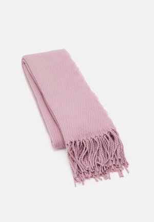 Écharpe tissée rose clair avec extrémités à franges torsadées, pliée soigneusement sur un fond blanc.