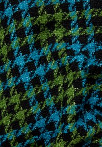 Woven fabric featuring a houndstooth pattern in vibrant blue, green, and black colors. Textured finish with rich, curly fibers.