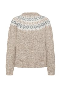 Pull beige en tricot à manches longues avec un motif d'empiècement rond en formes géométriques blanches et grises.