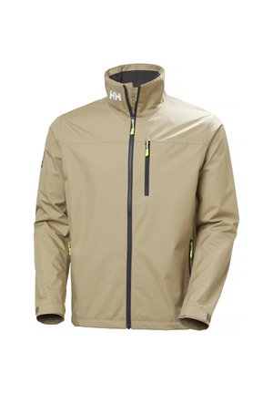 Chaqueta impermeable beige con cuello alto, cremalleras negras, tiradores de cremallera en amarillo neón y logotipo "HH" en el cuello.