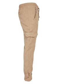 Beige Cargohose mit elastischem Bund, Kordelzug, Seitentaschen und Knie-Cargotaschen. Hergestellt aus leichtem Baumwollmaterial.
