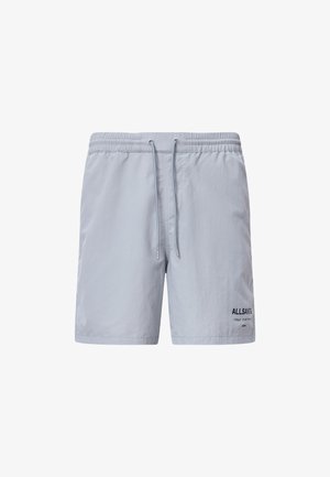 Light gray swim shorts made of nylon, featuring an elastic waistband with a drawstring, side pockets, and black logo detail.
