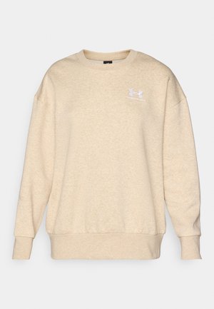 Sudadera beige hecha de tejido texturizado, con cuello redondo, mangas largas y un pequeño logo blanco en el lado izquierdo del pecho.