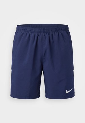 Pantalones cortos deportivos azul marino con cintura elástica y logo blanco de Nike en la parte inferior izquierda de la pierna, mostrados sobre un fondo liso.