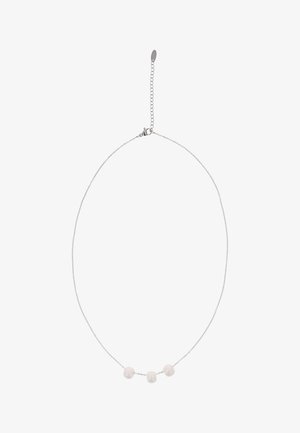 Delicate silver chain necklace with three small irregular white beads evenly spaced at the center and a lobster clasp with extension chain.