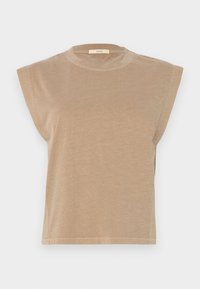 Camiseta de manga corta beige con un corte relajado, hombros ligeramente caídos y un escote redondo. Fabricada con un tejido suave y de textura lisa.