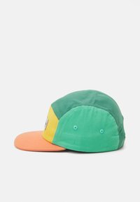 Multi-colored cap featuring green, yellow, and orange panels. Smooth cotton fabric, curved brim, and adjustable snapback closure.