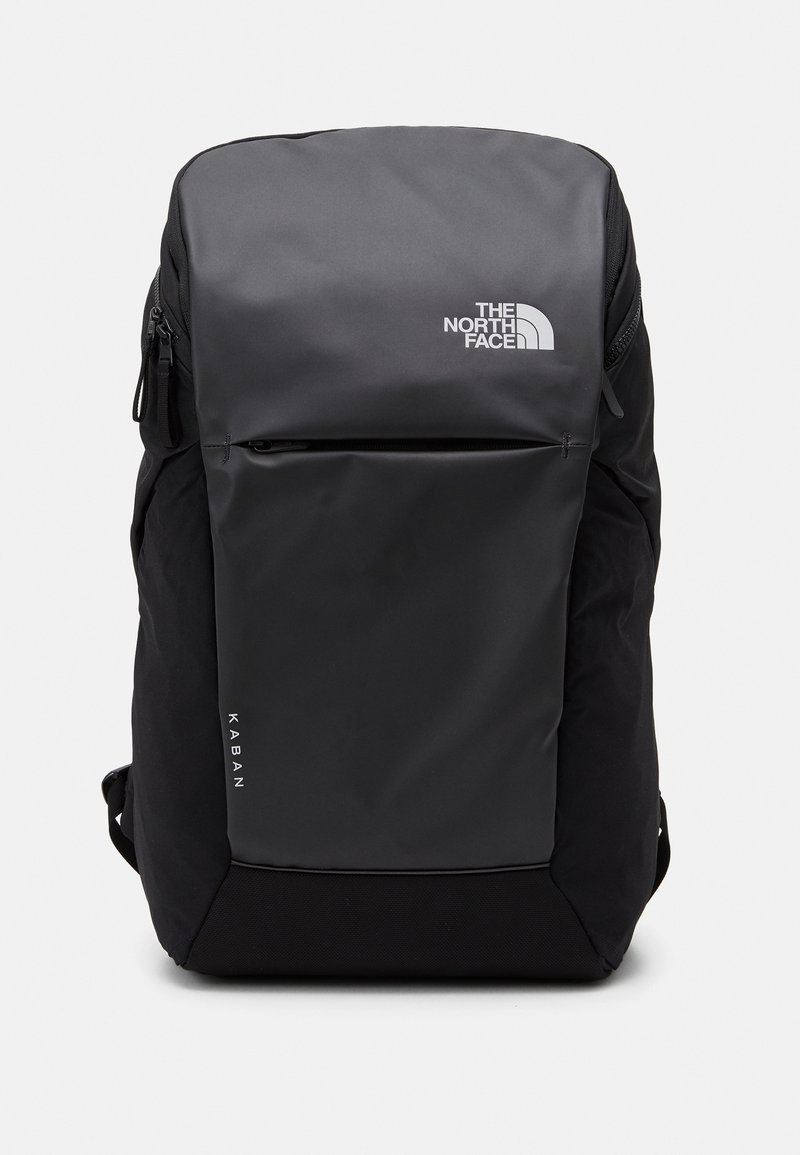 Sac à dos noir The North Face Kaban avec poche avant zippée et logo sur fond uni.