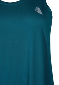 Teal tank top made of smooth fabric features a rounded neckline and a small, white geometric logo on the upper left side.
