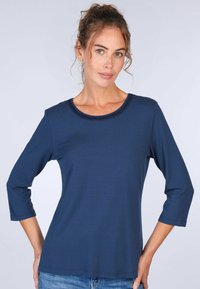 Marineblaues Langarmshirt mit Rundhalsausschnitt und strukturiertem Besatz. Aus glattem Stoff gefertigt, verfügt es über eine lockere Passform und einen lässigen Stil.
