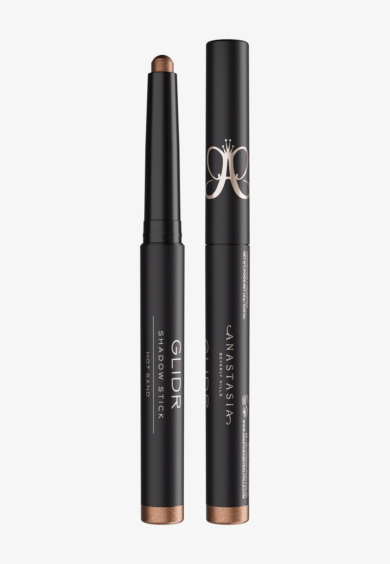 Stylo ombre GLIDR d'Anastasia Beverly Hills en teinte Hot Sand, montrant un stylo ouvert avec fard à paupières bronze et un stylo fermé avec le logo.