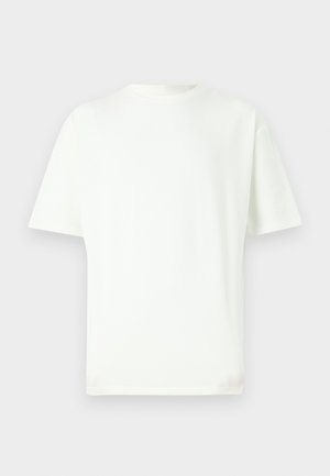 Hvid bomulds t-shirt med rund halsudskæring, korte ærmer og lige snit. Glat tekstur og minimalistisk design, ingen mønstre eller detaljer.