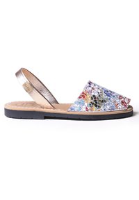 Multicolored slingback sandal with a shimmering metallic strap, a wide fabric upper featuring a mosaic pattern, and a black rubber sole.