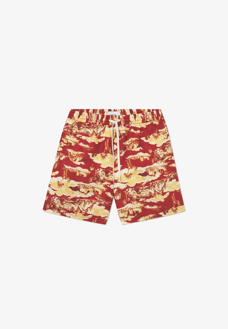 Red swim shorts featuring a yellow and beige landscape pattern, elastic waistband with drawstring, and smooth fabric texture.