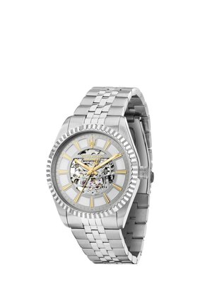 Orologio da polso in metallo argento con ingranaggi interni visibili, indici e lancette dorati, e cinturino in metallo a maglie.