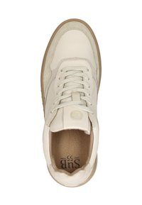 Cream-colored sneaker with beige suede detailing, white laces, brown sole, and visible "SUB 55" text inside the heel area.