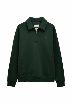 Dark green long-sleeve pullover with a half-zip front, stand-up collar, ribbed cuffs and hem, and a small logo on the left chest.