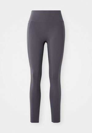 High-waisted leggings made of smooth, stretchy fabric in a dark gray color. Features a seamless design with no visible pockets or patterns.