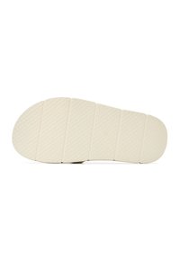 Semelle de chaussure en caoutchouc blanche, composée de six segments texturés ; présente un motif en losange pour l'adhérence et des bords arrondis pour le confort.