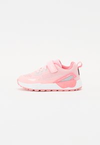 Pink athletic shoe with mesh upper, adjustable strap, and padded collar. Features white and gray accents, textured rubber sole, and logo.