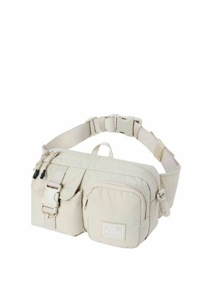 Marsupio beige con tracolla regolabile, multiple tasche con zip, tasca frontale con fibbia e etichetta del marchio Dakine sulla tasca frontale.