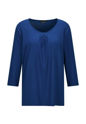 Blaues Hemd mit drei Viertelarmen, Rundhalsausschnitt und dezentem Faltenwurf vorne, aus weichem, leichtem Stoff gefertigt.