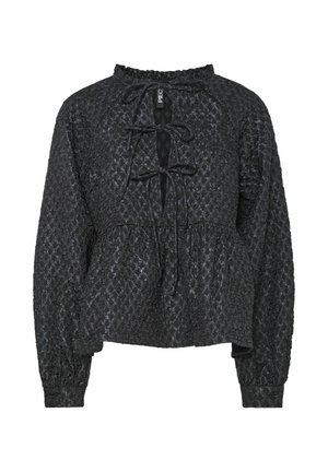 Sort tekstureret bluse med en rynket halsudskæring, snøring foran, lange ærmer og peplumnederdel. Stoffet har et subtilt mønster.