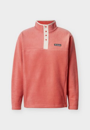 Coral fleece pullover with a high collar, cream button placket, and a small logo patch on the chest. Soft, uniform texture throughout.