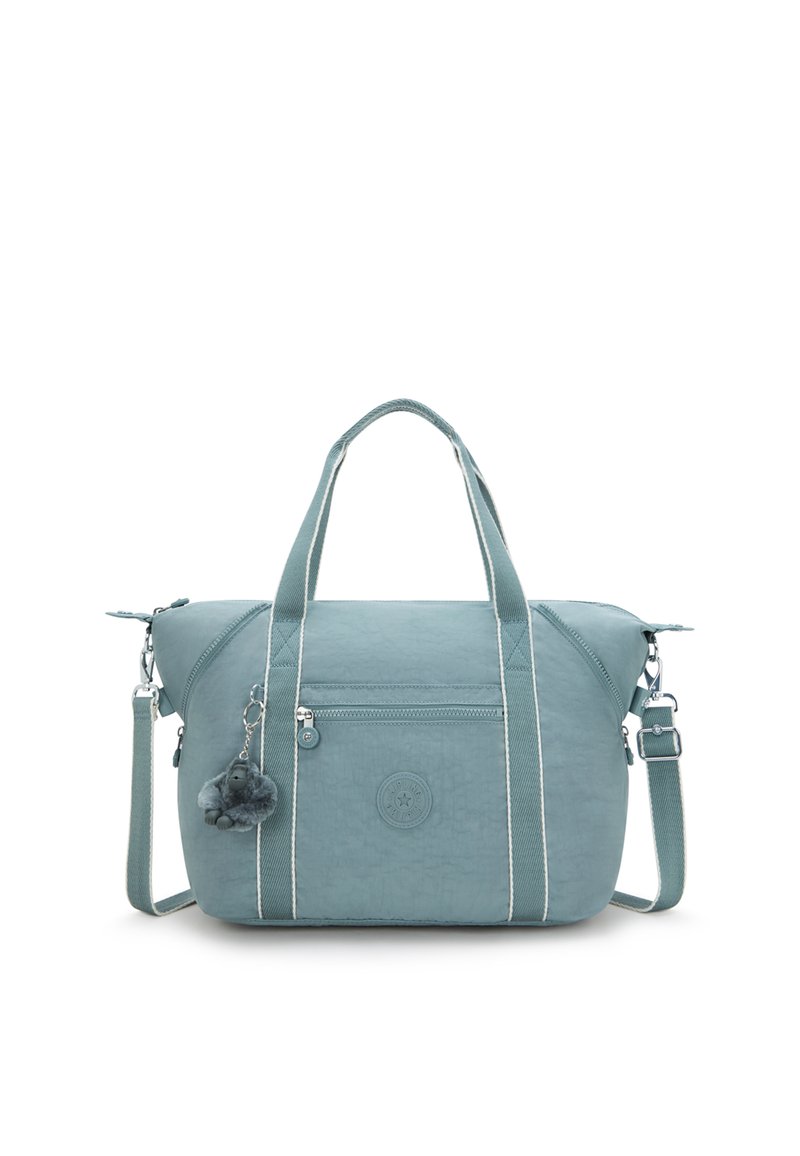 Teal fabric handbag with white stripes, two handles, detachable shoulder strap, front zip pocket, and a furry keychain accessory.